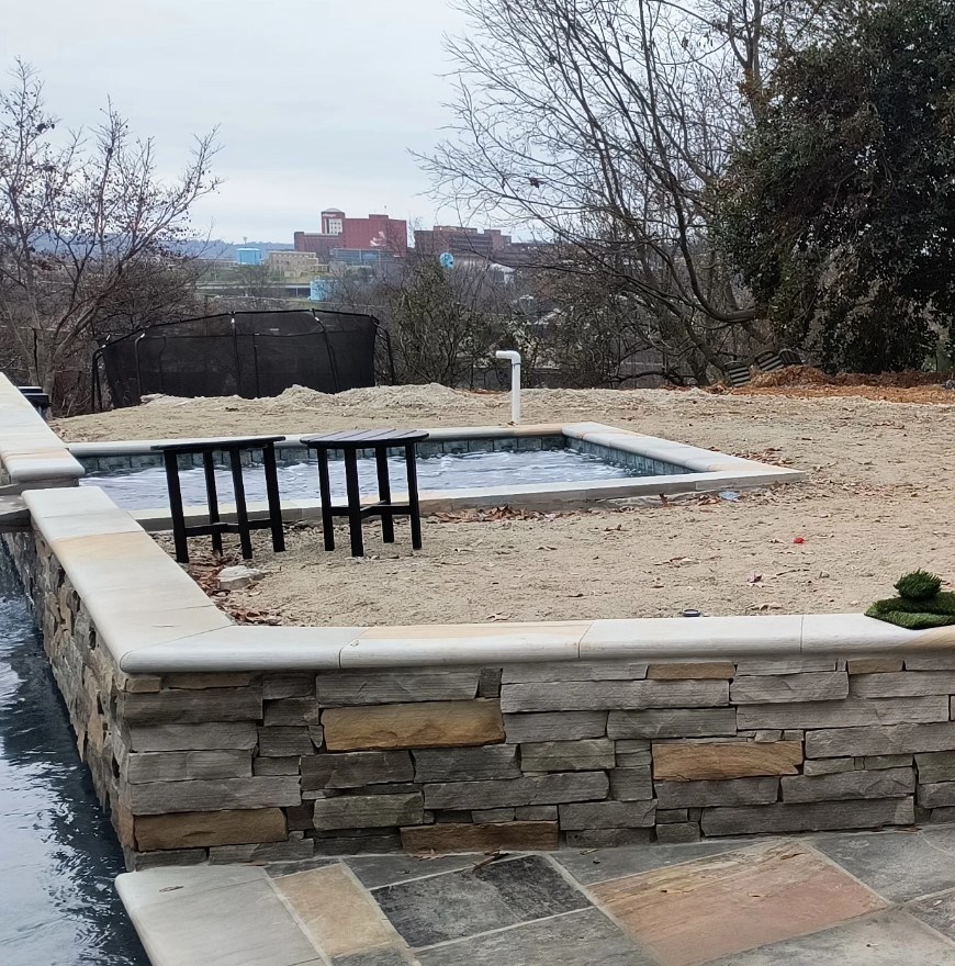 Pool and stone wall area prepared for landscaping