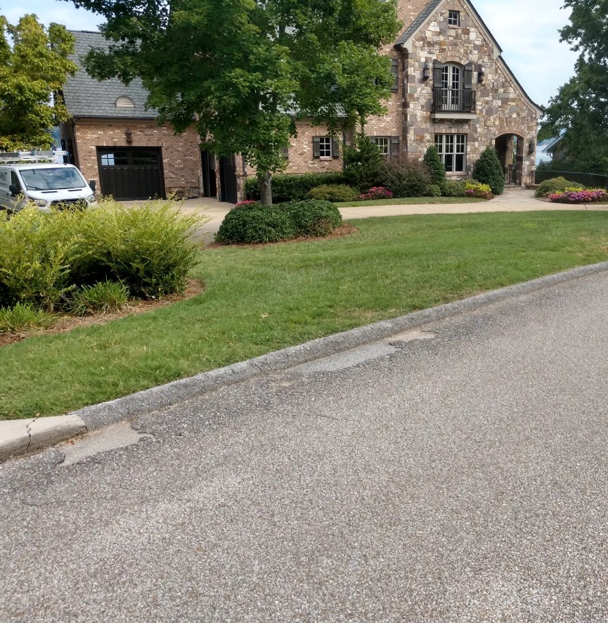 Landscaped residential property and maintained front lawn