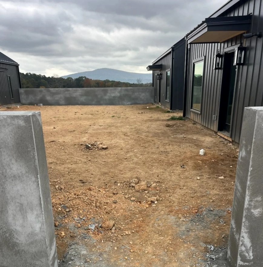 Prepared soil courtyard between modern buildings
